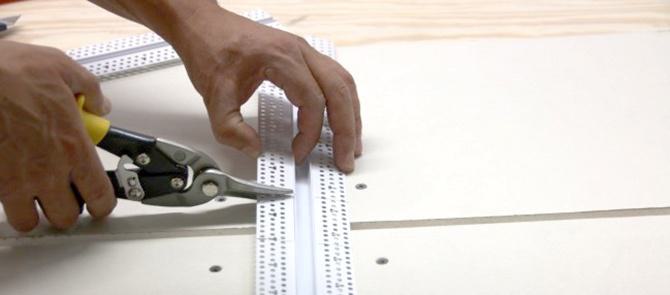 Using snips, cut along the markings that were made with the speed square. Using snips, cut along the markings that were made with the speed square.