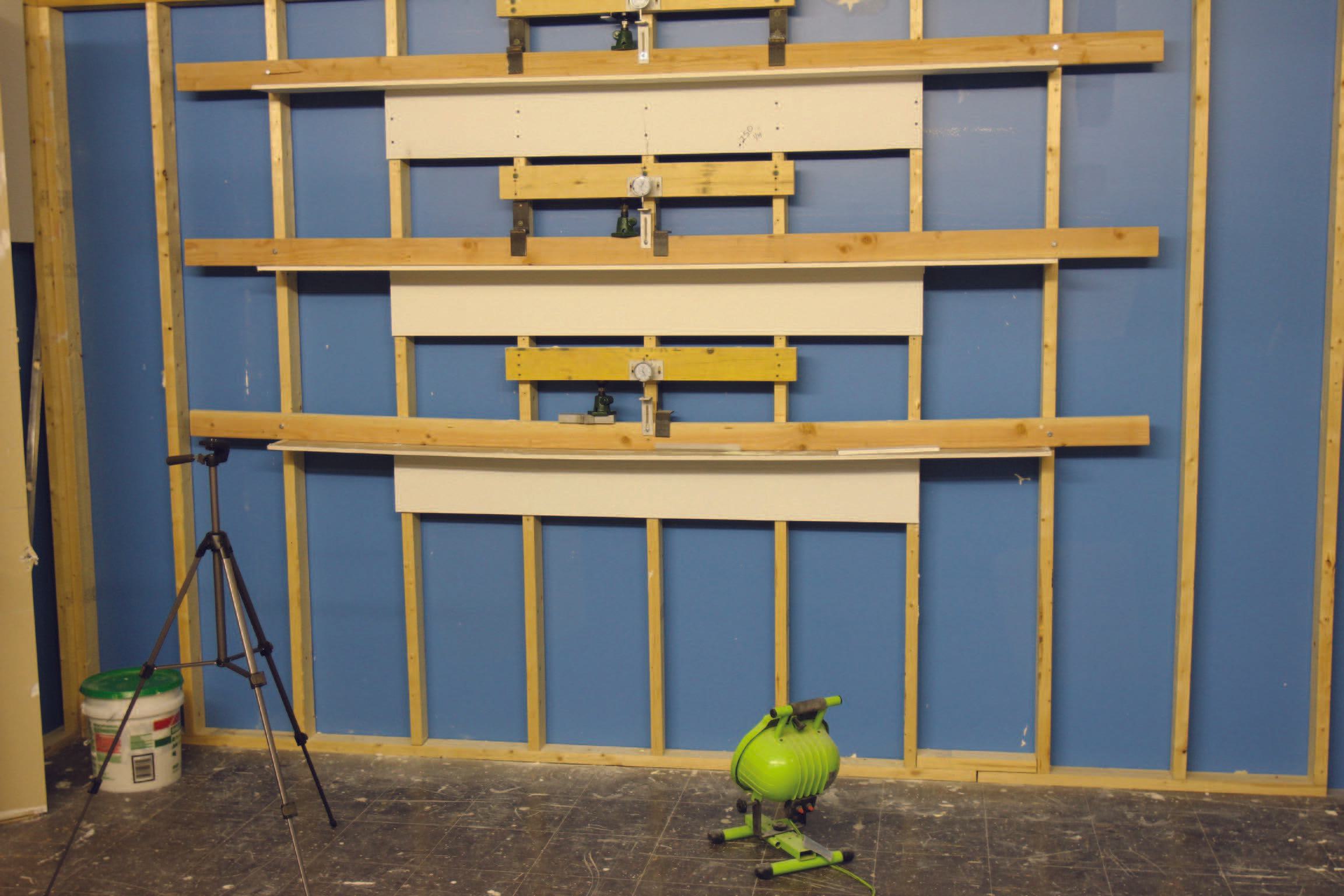 Testing jigs are used in the Trim-Tex lab. Testing jigs are used in the Trim-Tex lab.